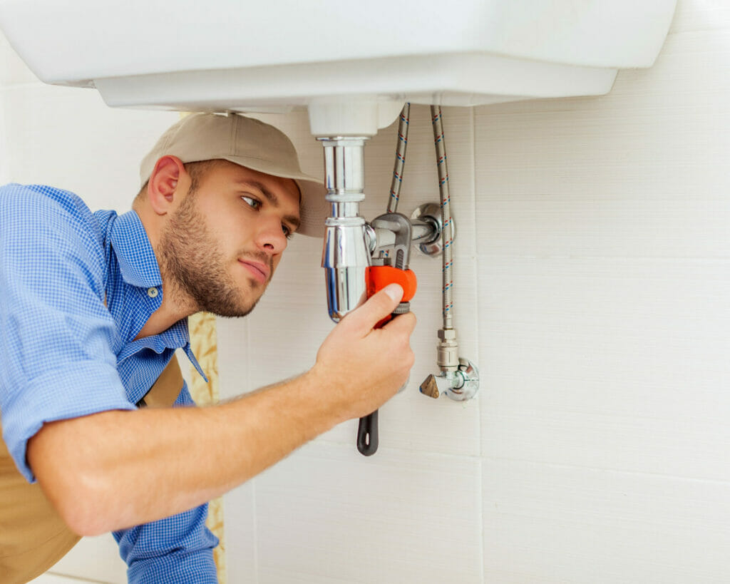 A plumber providing efficient plumbing repair.
